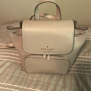 Kate Spade New York Darcy Flap Drawstring Medium Backpack in Warm Taupe